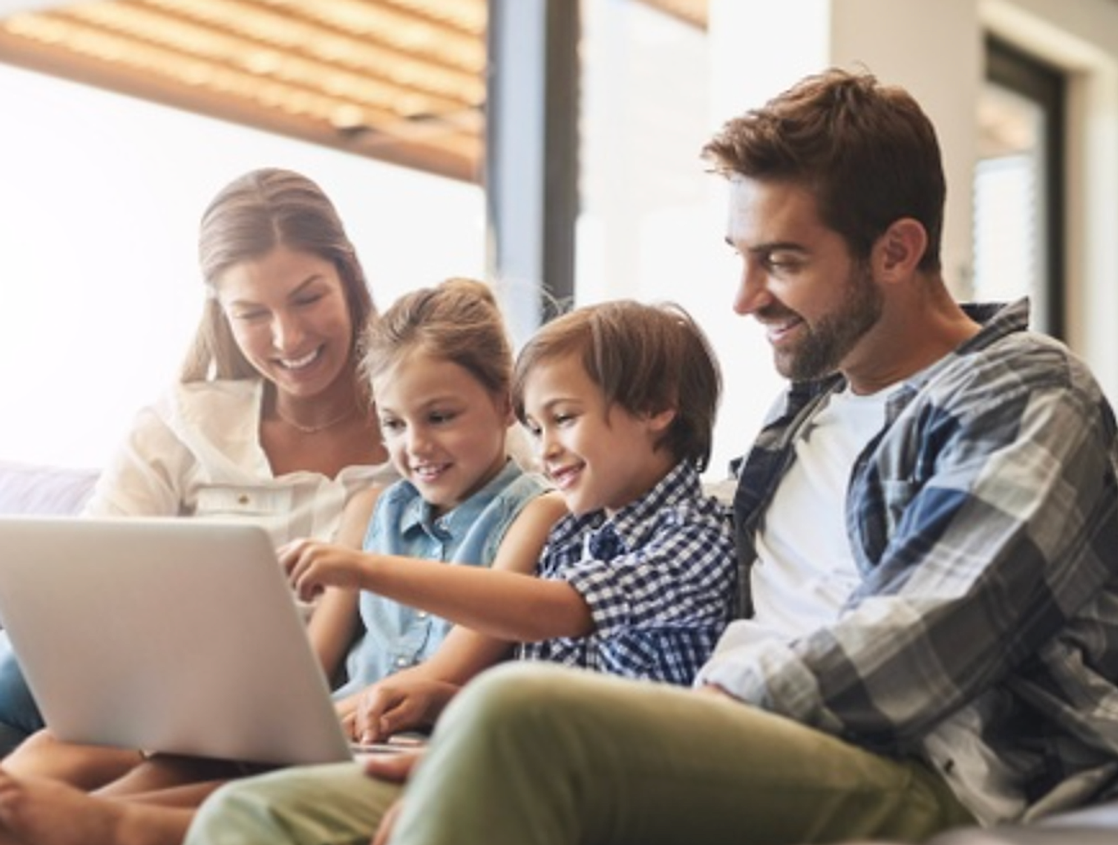 A family reviewing their mortgage options together on a laptop at home